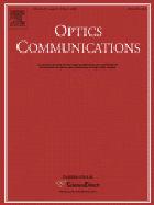 Performance of combined <100>-<110> ZnTe crystals in an amplified THz time-domain spectrometer